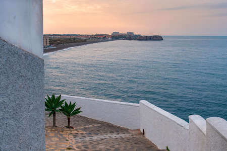 Street and balcony overlooking the sea and SalobreÃ±a beach, in the town of La Caleta de SalobreÃ±a.の写真素材