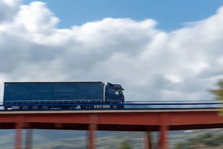 Truck driving on a bridge with speed effect.の写真素材