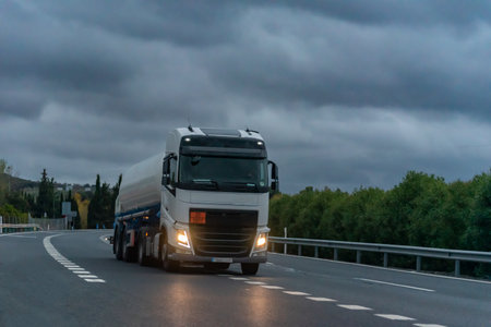 Tanker truck for the transport of dangerous gases circulating on a stormy day.の写真素材