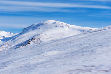 Summit of Mulhacen in winter, all covered by a blanket of snow.