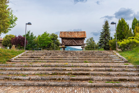 Old brick and stone stairs leading to a horreo in RiaÃ±o, Leon province.のeditorial素材