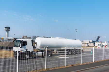 Aviation fuel tanker unloading at an airport facility.の写真素材