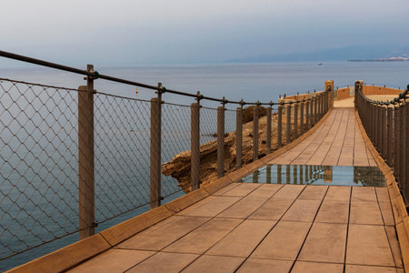 Jolucar suspension footbridge, in Torrenueva Costa, Granada, view of the wooden footbridge and with a part of the floor in transparent glass.の写真素材