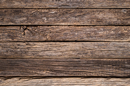 Rustic wood slat background, old and weather cracked wood, close up.の写真素材