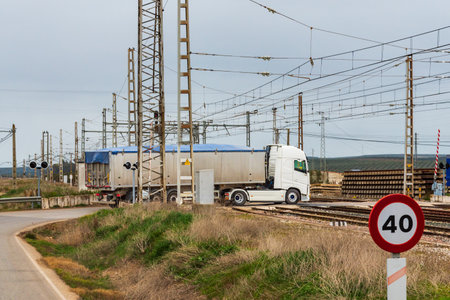 Truck crossing the train roads through a level.の写真素材