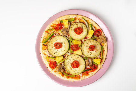 Vegetable pizza for vegetarians, with aubergine, pepper, cherry tomato, onion, mushroom and pineapple to give it sweetness.の写真素材