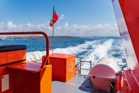 Rear view from the boat of a pleasure boat for tourists in the Algarve.の写真素材