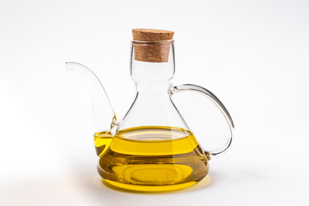Typical oil jug with gold-colored virgin olive oil.の写真素材