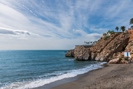 Carabeo Beach and the Balcon de Europa promenade in the background in the municipality of Nerja.の写真素材
