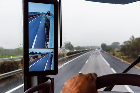 Rearview mirror with cameras in a truck, screen inside the vehicle where the driver can see the back of the trailer.の写真素材