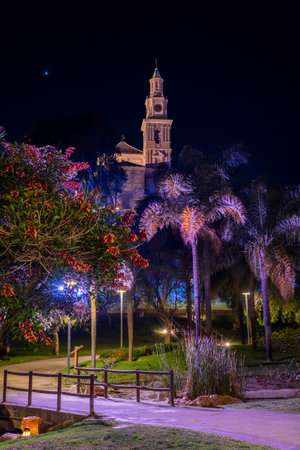 Park of the towns of America and its peculiar lighting with the Sanctuary of Nuestra SeÃ±ora de la Cabeza in the background and at night Motril.の写真素材