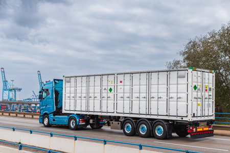 Truck with open side container with labels for dangerous goods.の写真素材