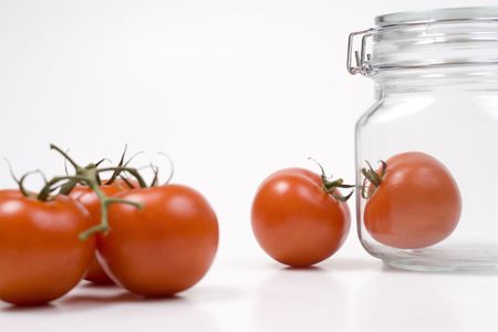 Tomatoes in a jarの写真素材