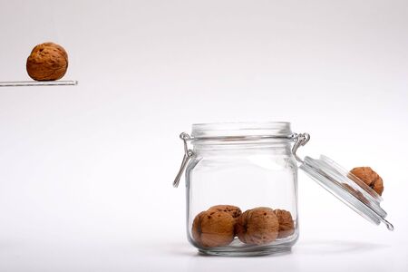 Walnut jumping in a jarの写真素材