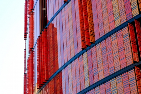 Contemporary office building with red orange colored windows