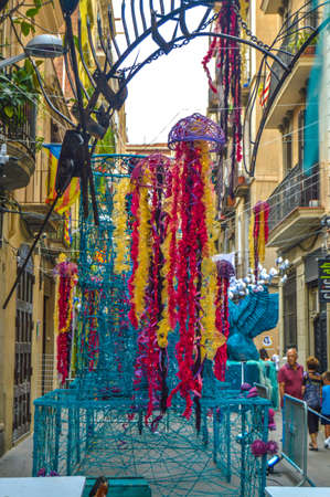 Fiesta Major de Gracia, Carrer Llibertat, Barcelona, Spain - August 2019. Decorated streets of Gracia districtのeditorial素材