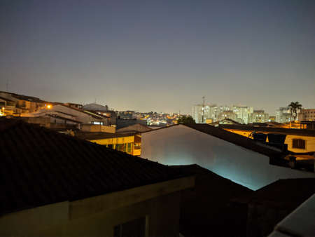 Night sky in Guarulhos, in the background in the glare, are the lights of Guarulhos International Airportの写真素材