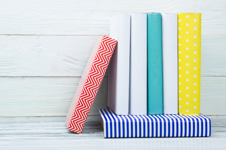Stack of books on wooden table. Back to school. Copy space.の写真素材