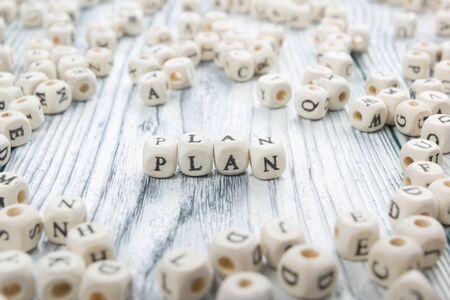 Plan word written on wood block. Wooden ABC