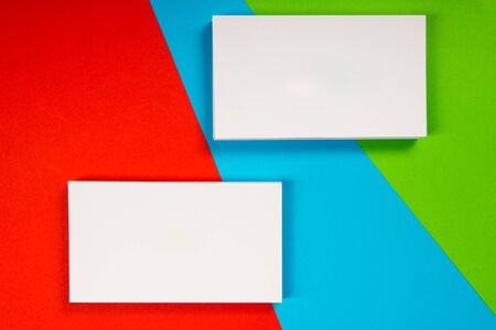Blank white business cards on color background.の写真素材