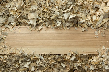 Carpenter tools on wooden table with sawdust. Carpenter workplace top view.の写真素材