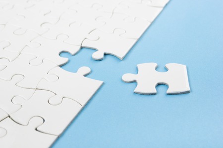 Missing jigsaw puzzle pieces. Business concept. Compliting final puzzle taskの写真素材