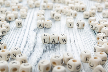 Law word written on wood block. Wooden ABC.の写真素材