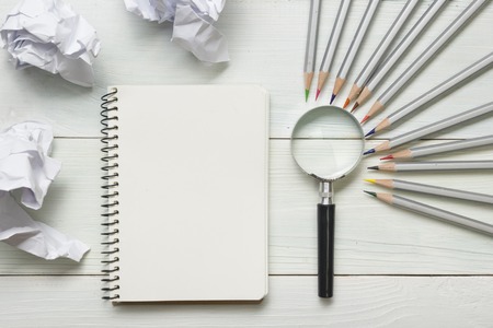 Paper balls and pen over blank white sheet - Creativity crisis conceptの写真素材