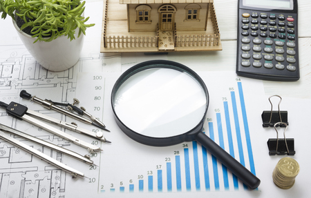 Model house, construction plan for house building, magnifying glass, divider compass. calculator. Real Estate Concept. Top viewの写真素材