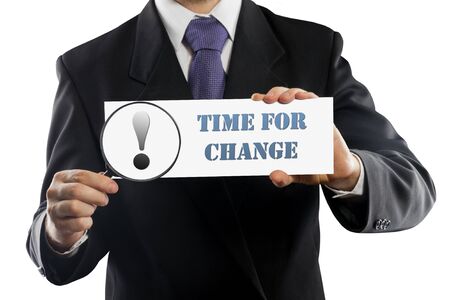 Close up businessman or salesman holding in hands magnifying glass and paper with Time for Change message isolated on white backgroundの写真素材