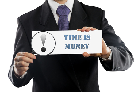 Close up businessman or salesman holding in hands magnifying glass and paper with time is money message isolated on white backgroundの写真素材