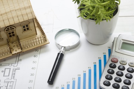Model house, construction plan for house building, magnifying glass compass. calculator. Real Estate Concept. Top viewの写真素材