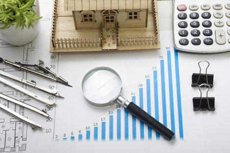 Model house, construction plan for house building, magnifying glass, divider compass. calculator. Real Estate Concept. Top viewの写真素材