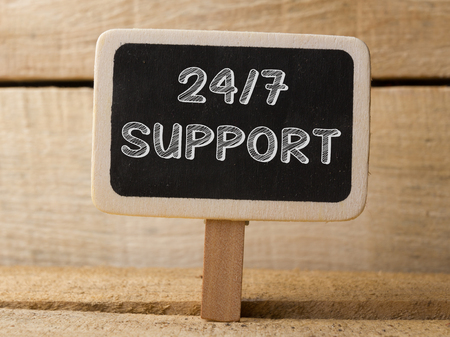 247 support  text write on Chalkboard at wooden background.の写真素材