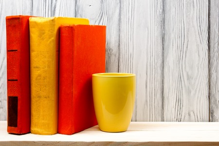 Stack of books on wooden table. Back to school. Copy space.の写真素材