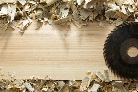 Carpenter tools on wooden table with sawdust. Carpenter workplace top view.の写真素材