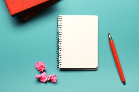 Office desk table with supplies and crumpled paper. Top view. Copy space for text.の写真素材