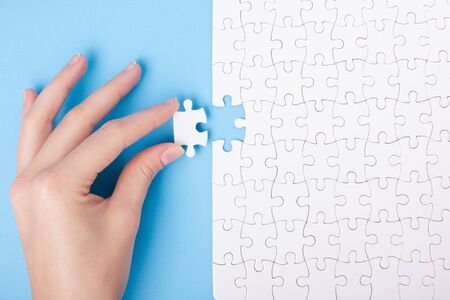 Missing jigsaw puzzle pieces. Business concept. Compliting final puzzle taskの写真素材