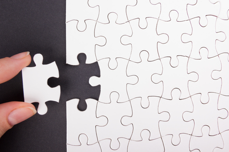 Missing jigsaw puzzle pieces. Business concept. Compliting final puzzle taskの写真素材