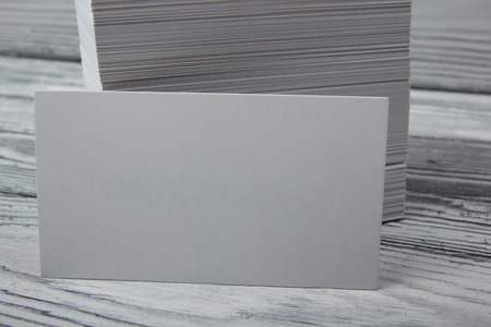 Blank white business cards on wood background.の写真素材