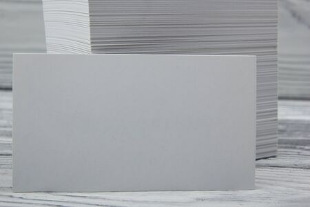 Blank white business cards on wood background.の写真素材