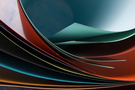 Macro image of colorful curved sheets of paper. Abstract backgroundの写真素材