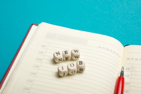 Job interview concept . Office table top view. Notepad, pen and reminder with word.