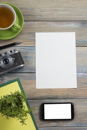Tourism, travel concept. Office desk table with notepad, camera and supplies. Top view. Copy space...
