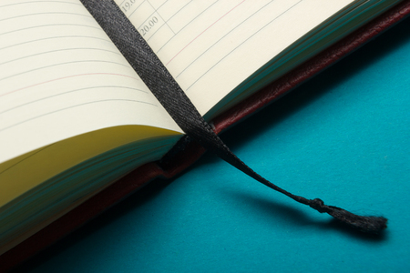 Close-up view of open books with bookmark.の写真素材