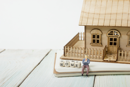 Wooden blocks spelling the word Home on wood tableの写真素材