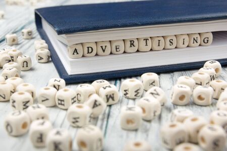 Advertising word written on wood block. Wooden ABC.の写真素材