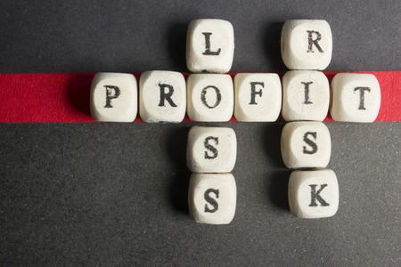 Profit, loss and risk crossword blocks on table. Top view.の写真素材