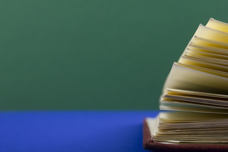 Macro view of book pages on colorful paper background. Copy space for textの写真素材