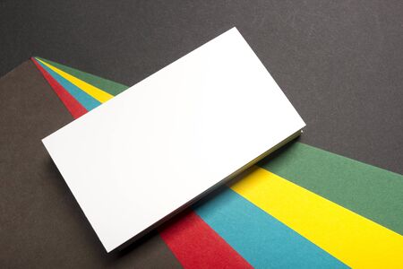 Business card blank over colorful abstract background. Corporate stationery branding mock-up.の写真素材